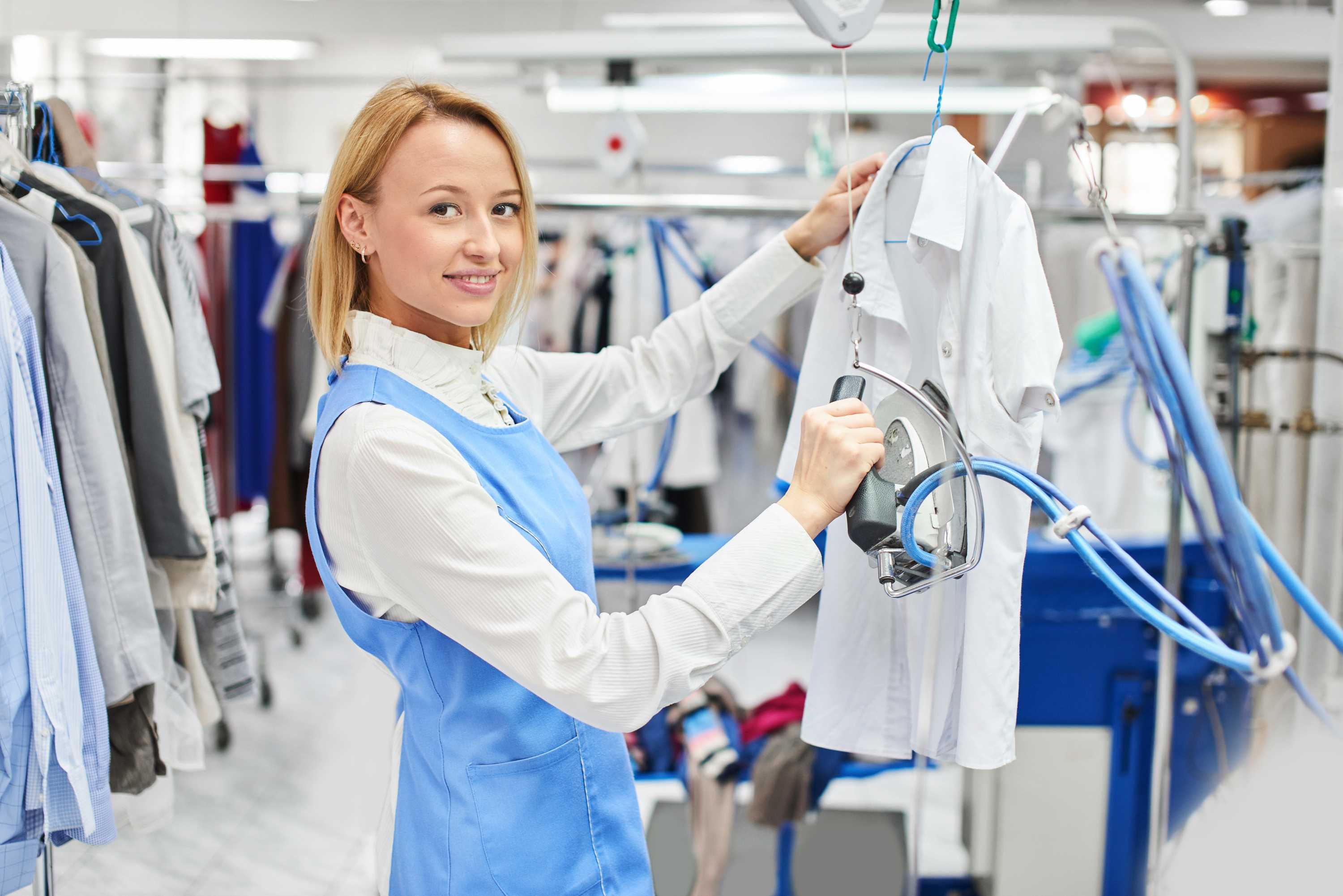 woman ironing white shirt