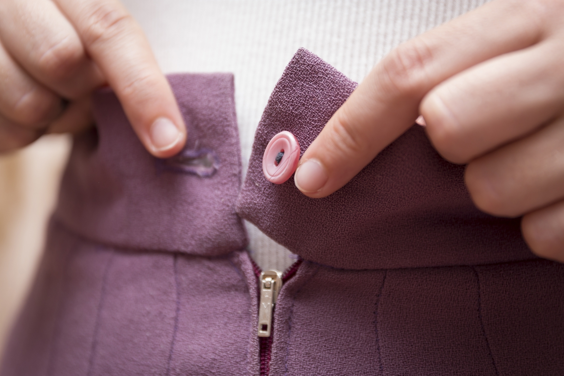 purple colored zip and button