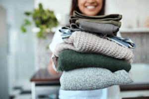 women holding washed clothes