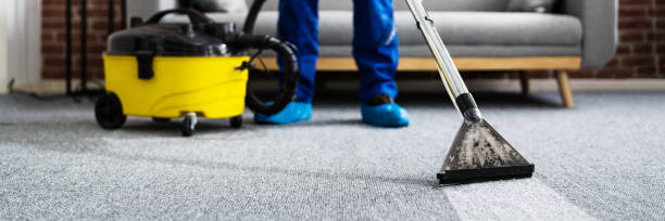 man cleaning carpet