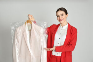 Dubai Marina Laundry - A woman is standing holding clothes.